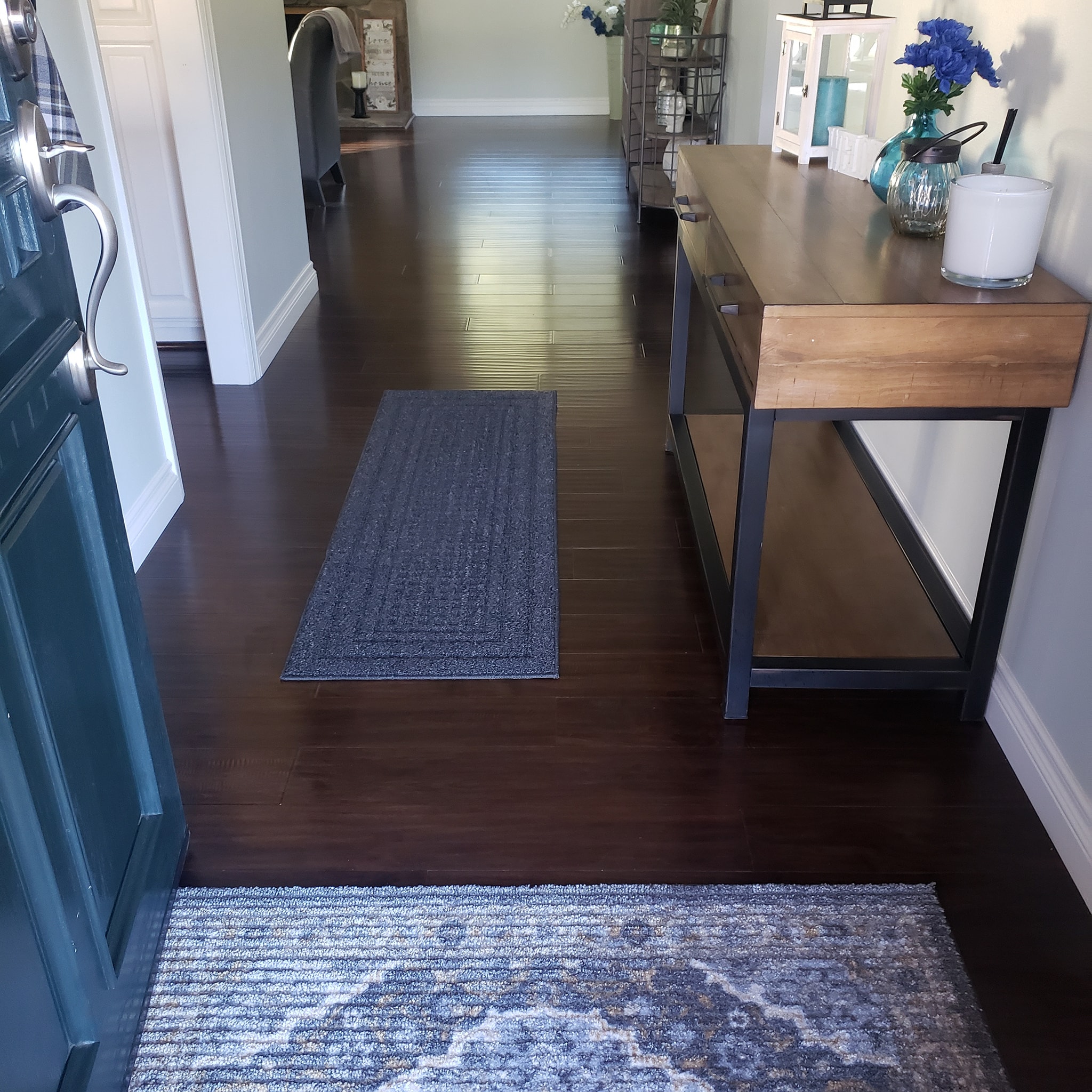 Clean and welcoming Santa Clarita home entrance with polished wooden floors, a neat console table, and decorative elements.