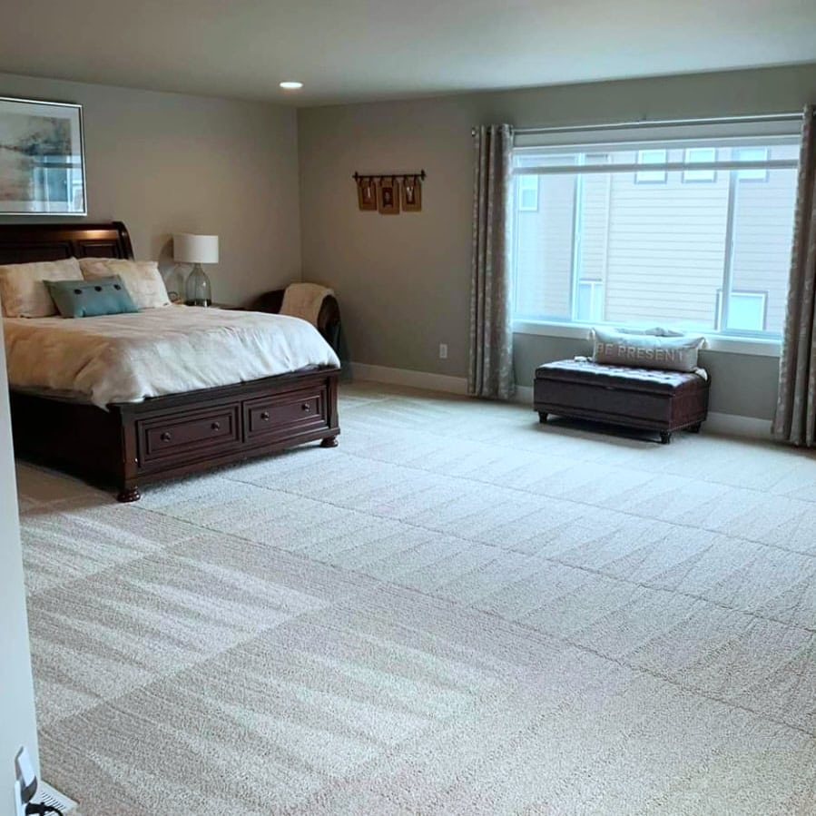 Bright and inviting bedroom with freshly cleaned carpet, highlighting Cyclone Cleaning & Janitorial’s attention to detail in residential cleaning.